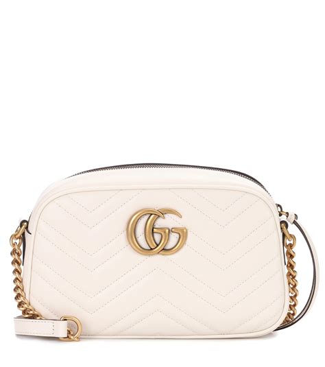 GG Marmont small shoulder bag in white tweed .